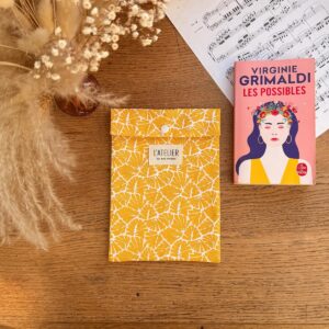 pochette à livre en coton blanc avec des feuillages jaunes